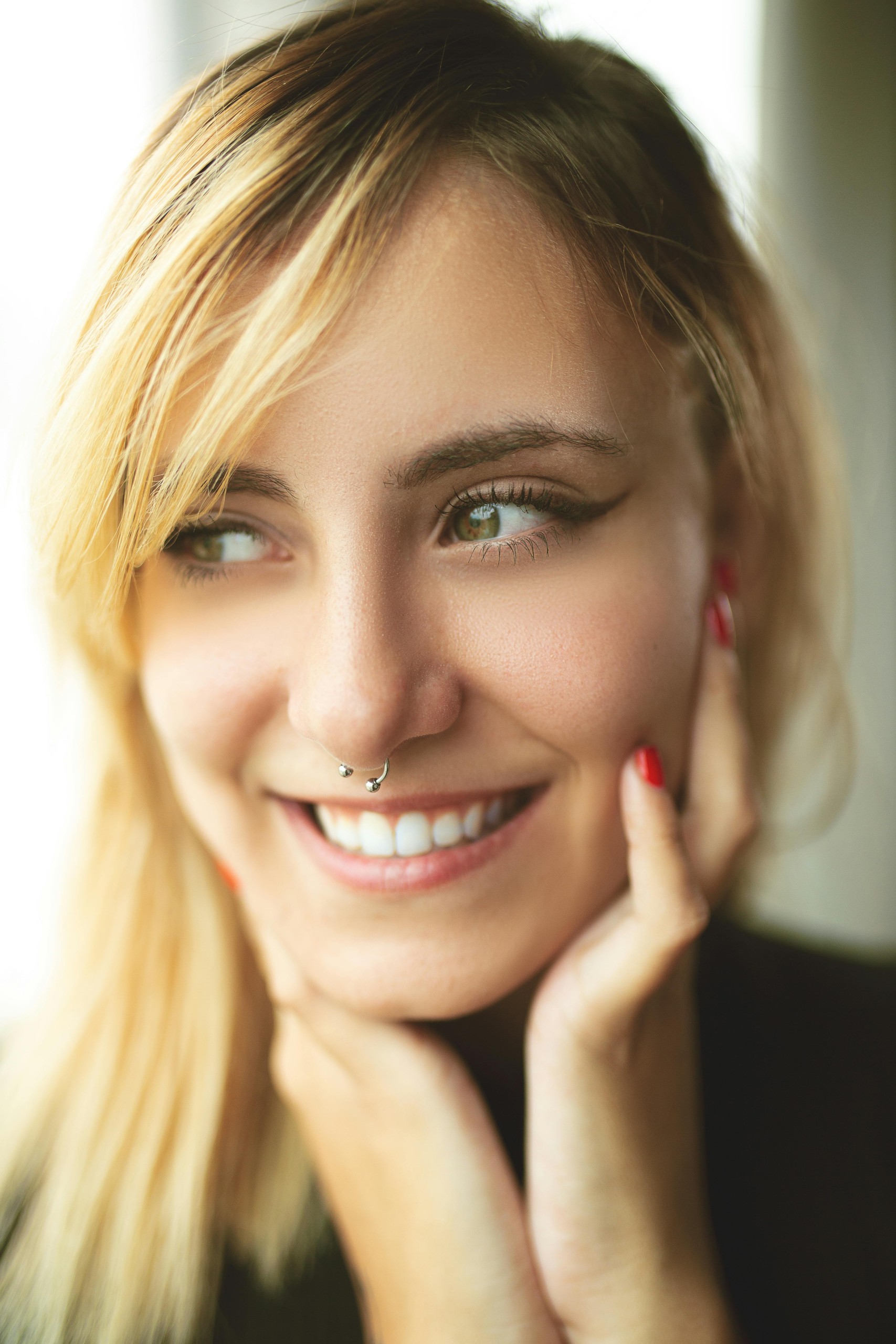 smiling woman with nose ring